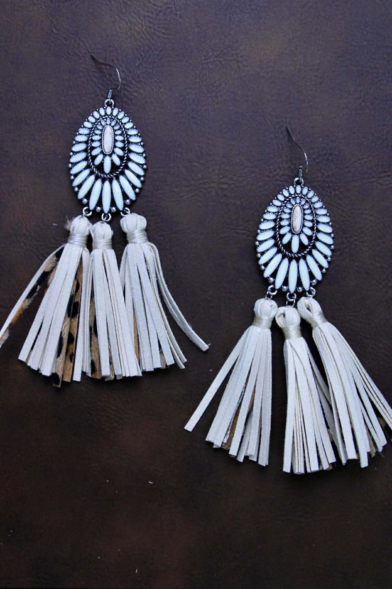 Squash with leather leopard tassels