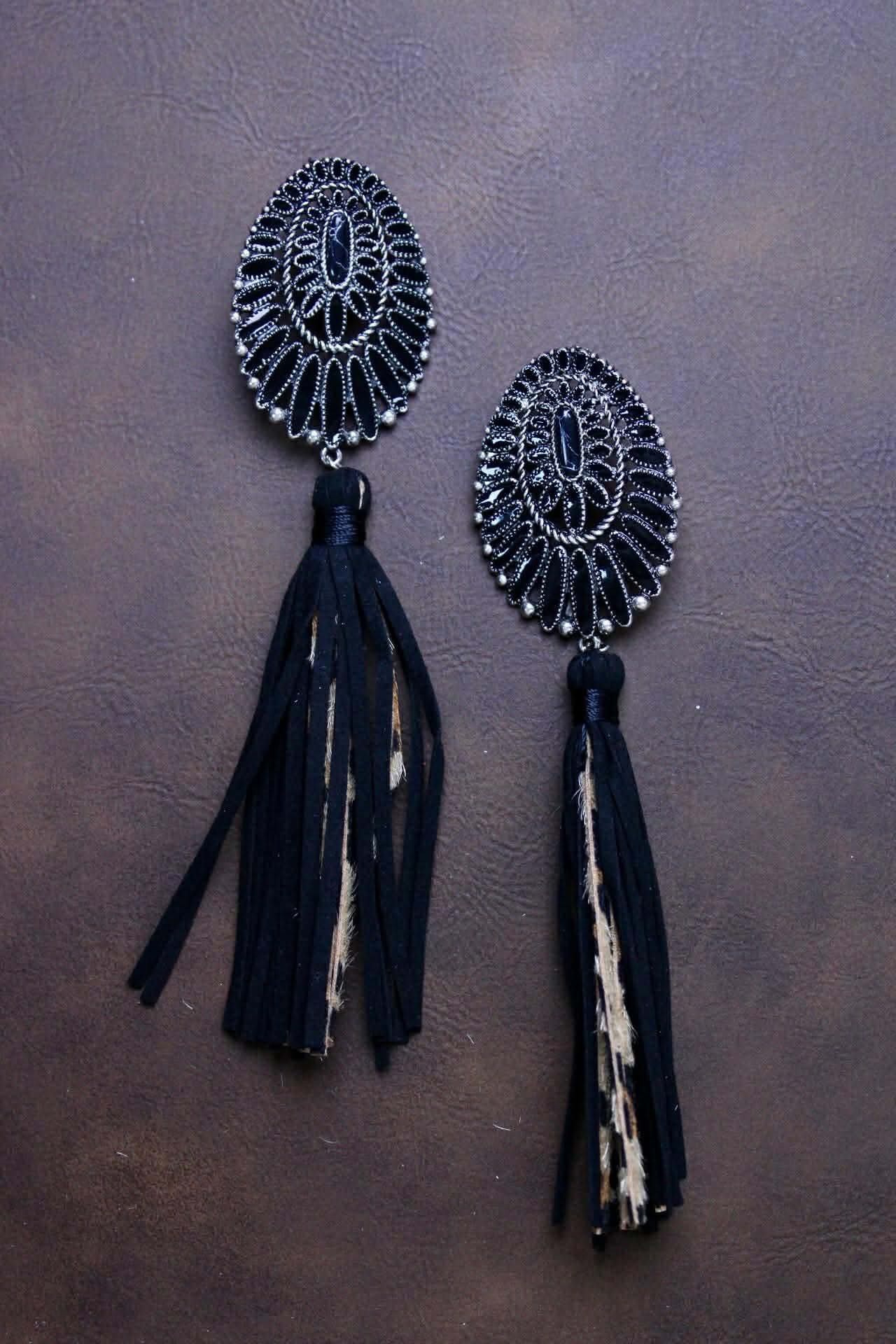 Squash with leather leopard tassels