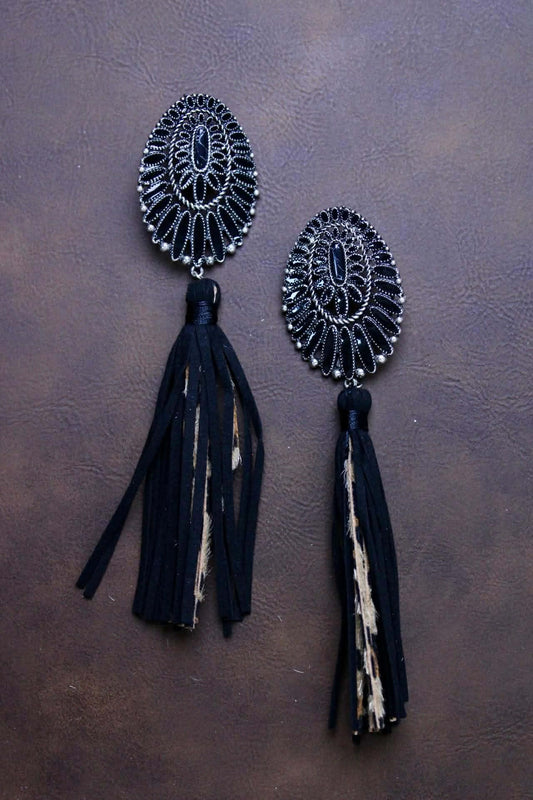 Squash with leather leopard tassels