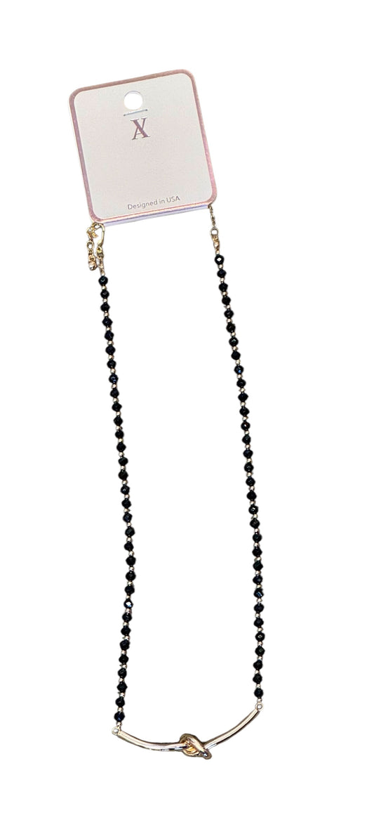 FACETED BEAD NECKLACE WITH KNOT ACCENT